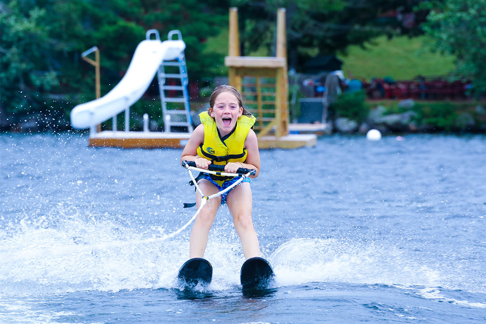 A young waterskier having a blast at Kingsley Pines Camp