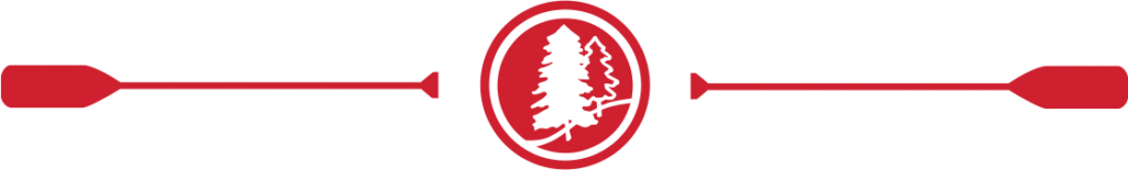 A decorative separator graphic with the Kingsley Pines red circle and trees mark with two oars on the left and right. 